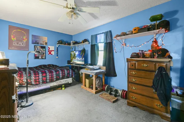 a bedroom with a bed and furniture