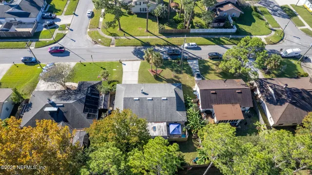 an aerial view of residential house with outdoor space and swimming pool