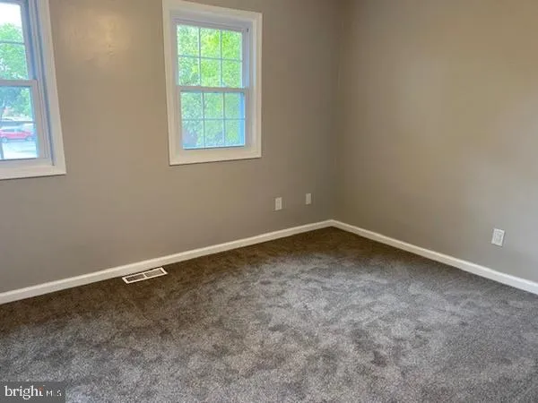 a kitchen with a refrigerator and a stove