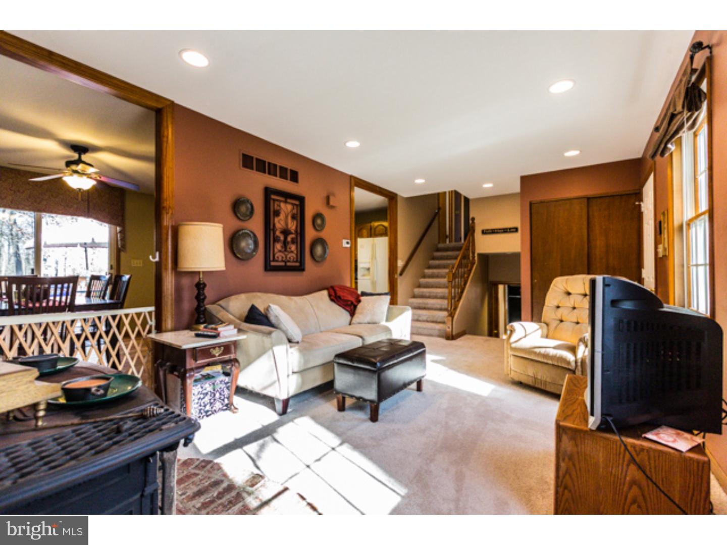 232 Cambridge Road Coatesville, PA 19320 - Photo 12 of 25 a living room with furniture and a flat screen tv