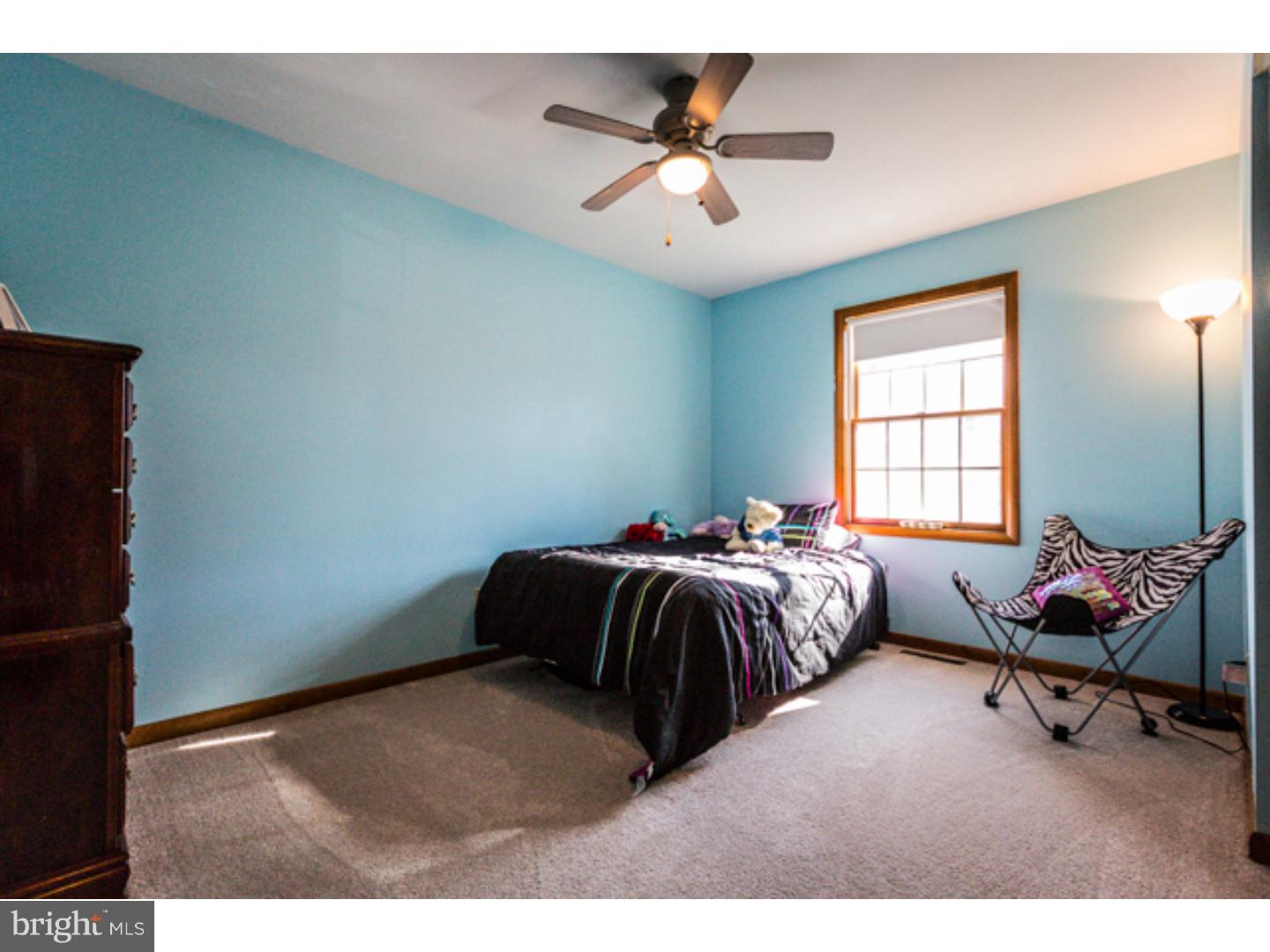 232 Cambridge Road Coatesville, PA 19320 - Photo 17 of 25 a bedroom with a bed and window