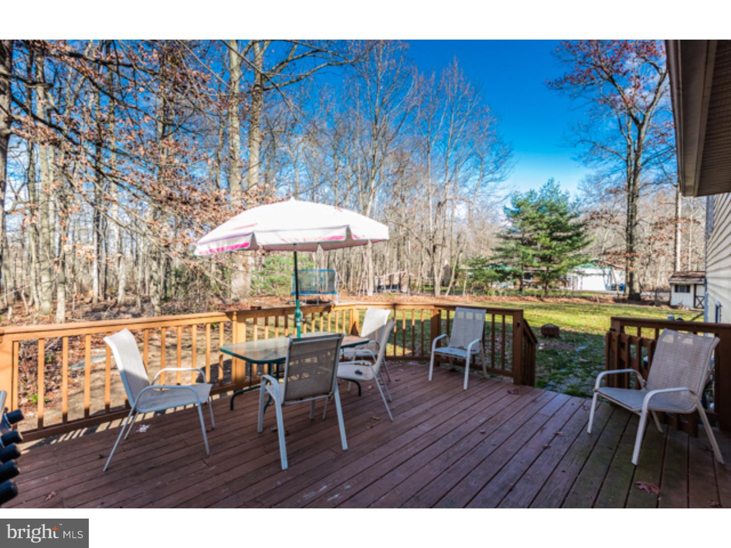 232 Cambridge Road Coatesville, PA 19320 - Photo 3 of 25 a view of a chairs and table on the wooden floor
