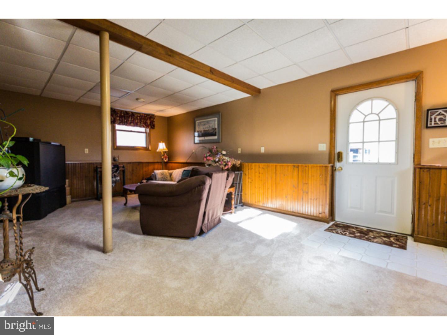 232 Cambridge Road Coatesville, PA 19320 - Photo 21 of 25 a view of a living room and a livingroom with furniture
