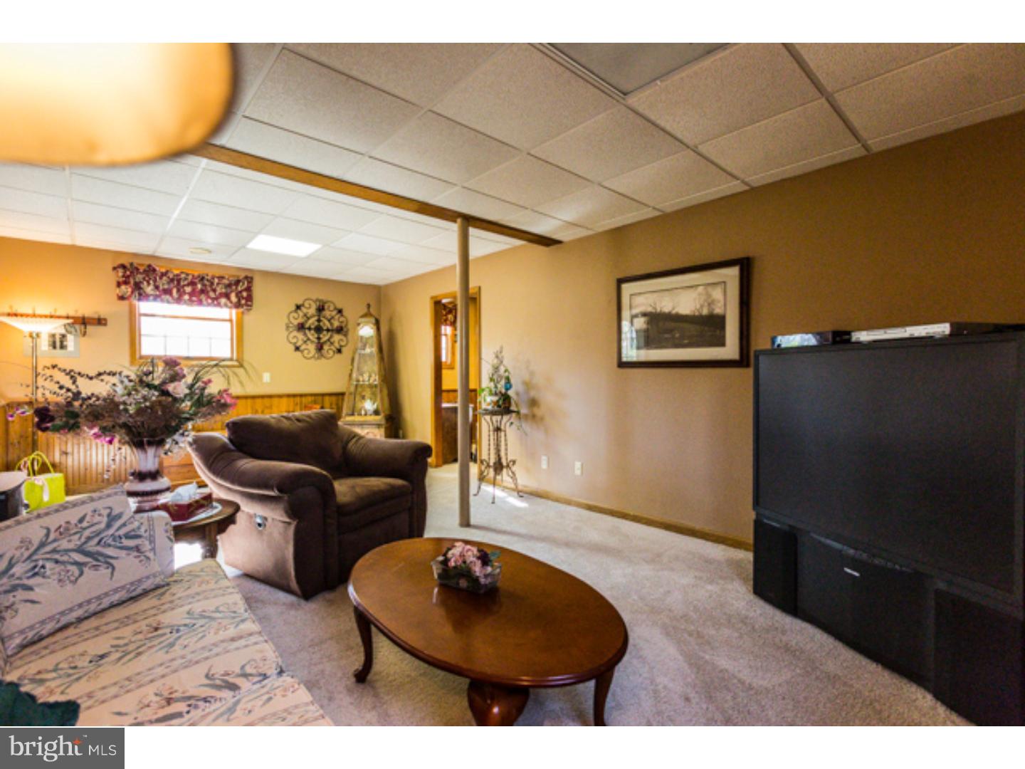 232 Cambridge Road Coatesville, PA 19320 - Photo 22 of 25 a living room with furniture and a wooden floor