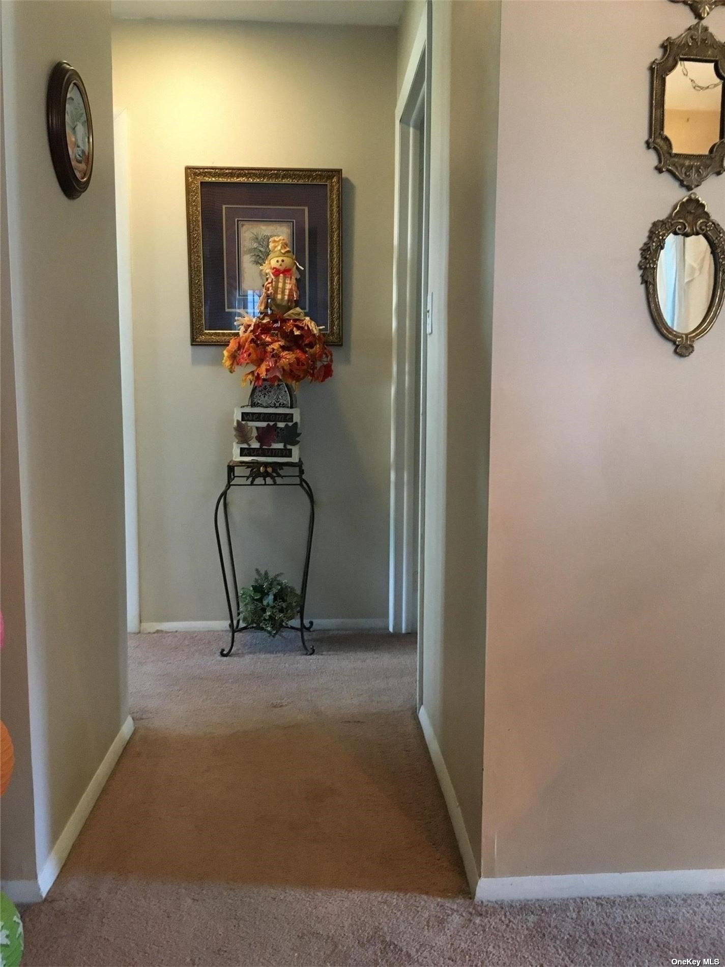 145 Edinburgh Drive, Unit 145 Ridge, NY 11961 - Photo 11 of 18 a view of a hallway with wooden floor