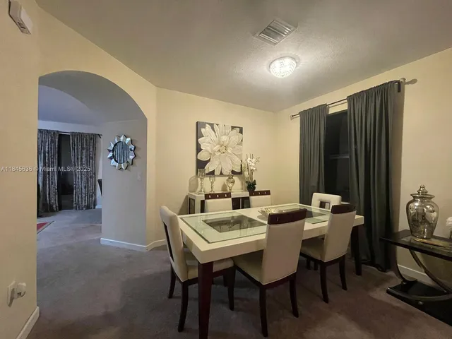a view of a dining room with furniture
