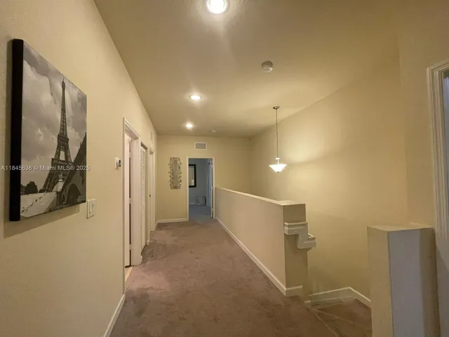 a bathroom with a sink a toilet a mirror and shower curtain