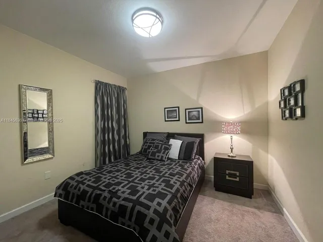 a kitchen with a refrigerator stove and microwave