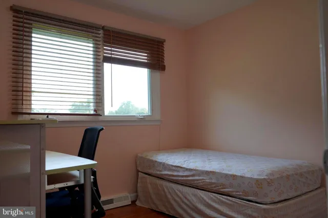 a room with a bed and a window