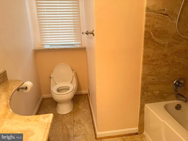 a bathroom with a toilet and a sink