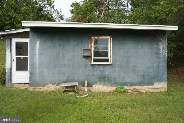 a terrace view with wooden floor and fence