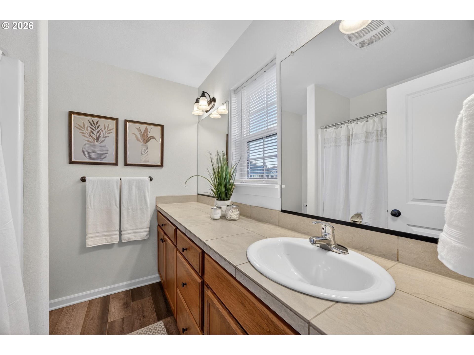 16260 Southwest Mason Lane Beaverton, OR 97006 - Photo 27 of 41 a bathroom with a sink and a mirror