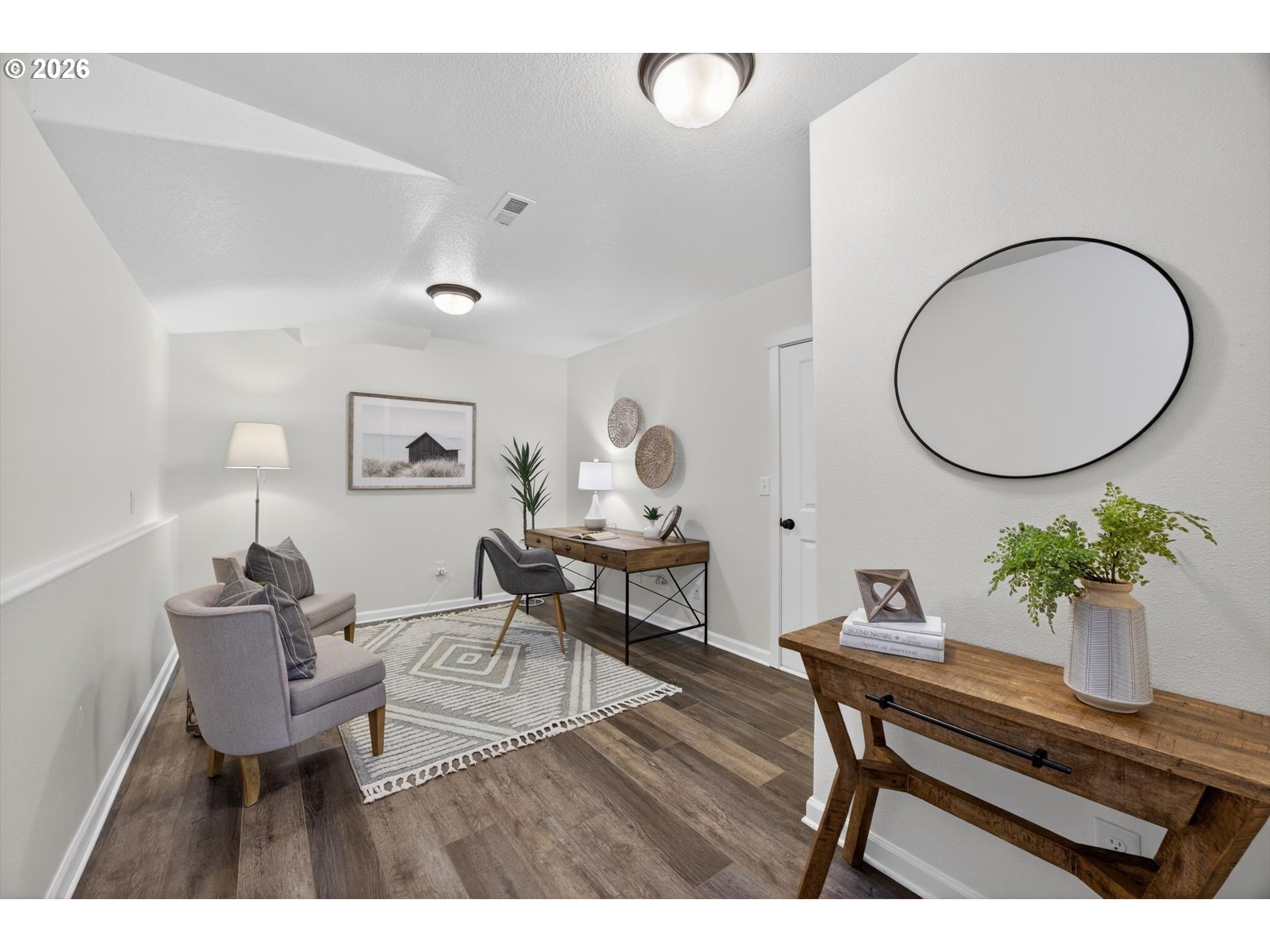 16260 Southwest Mason Lane Beaverton, OR 97006 - Photo 30 of 41 a living room with a table chair and a potted plant