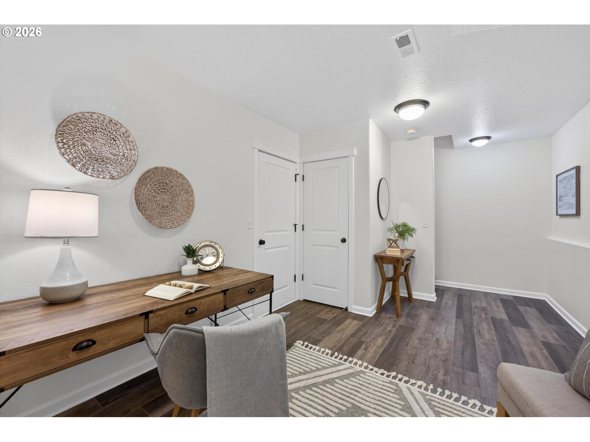 16260 Southwest Mason Lane Beaverton, OR 97006 - Photo 31 of 41 a living room with a wooden floor and a table