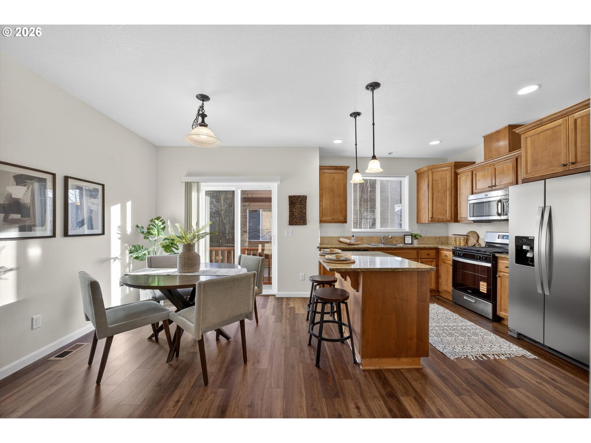 16260 Southwest Mason Lane Beaverton, OR 97006 - Photo 9 of 41 a view of a dining room with furniture window and wooden floor