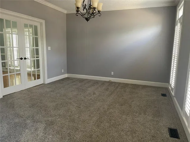 an empty room with windows