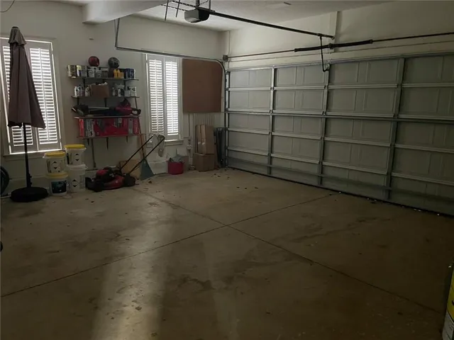 a bathroom with a potted plant and a sink