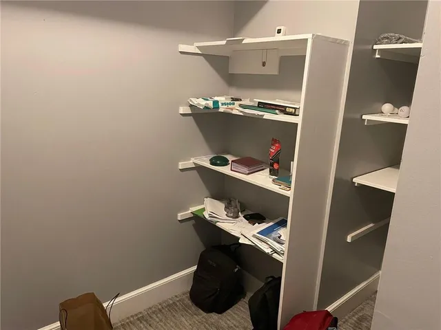 a view of a room that has a large window