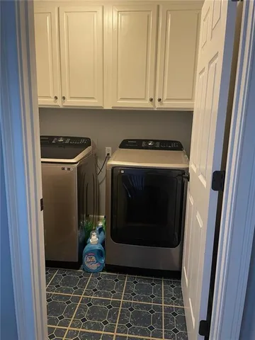 a view of swimming pool with a chair