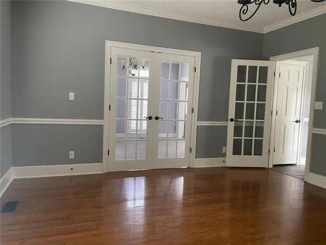 a view of a livingroom with wooden floor