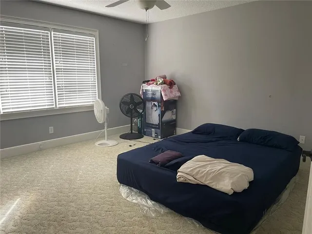 a living room with a bed