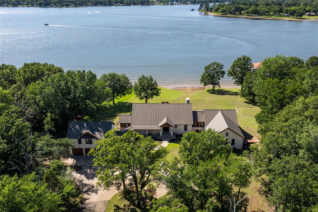 an aerial view of a house with a yard and garden