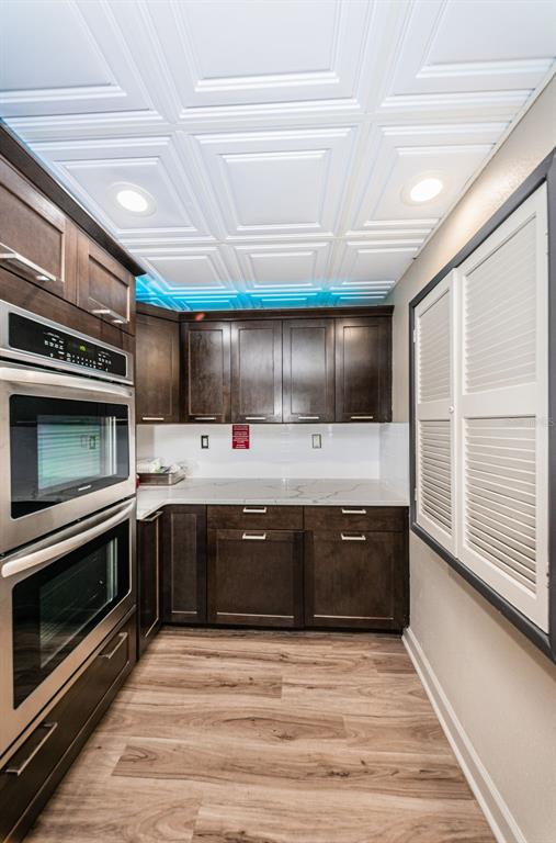 1 Boca Ciega Point Boulevard, Unit 314 St. Petersburg, FL 33708 - Photo 48 of 89 a view of kitchen with stainless steel appliances wooden floor and staircase