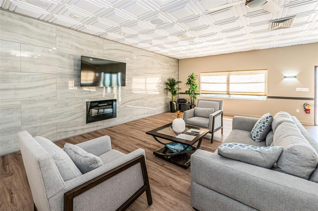 1 Boca Ciega Point Boulevard, Unit 314 St. Petersburg, FL 33708 - Photo 50 of 89 a living room with furniture and a fireplace