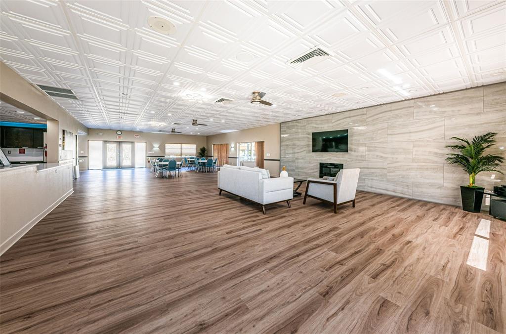 1 Boca Ciega Point Boulevard, Unit 314 St. Petersburg, FL 33708 - Photo 54 of 89 a living room with furniture and a wooden floor