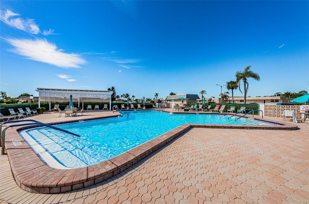 1 Boca Ciega Point Boulevard, Unit 314 St. Petersburg, FL 33708 - Photo 66 of 89 a view of a swimming pool with a patio