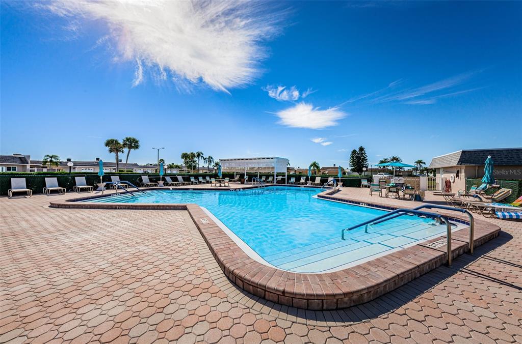 1 Boca Ciega Point Boulevard, Unit 314 St. Petersburg, FL 33708 - Photo 68 of 89 a view of a swimming pool with outdoor seating