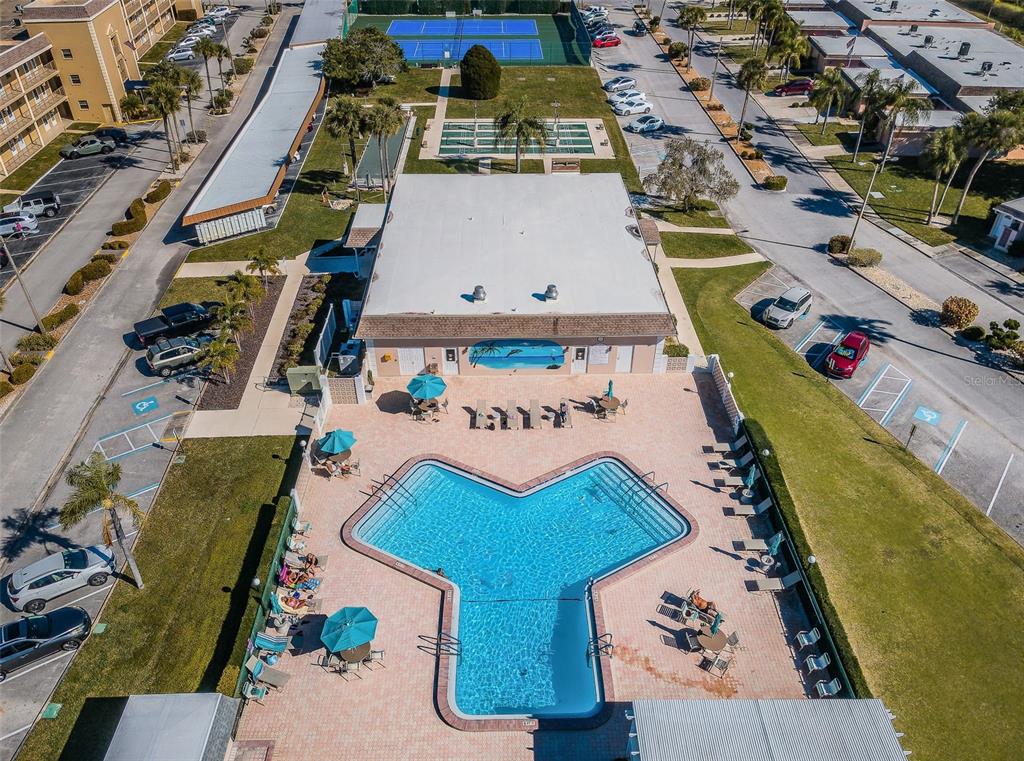 1 Boca Ciega Point Boulevard, Unit 314 St. Petersburg, FL 33708 - Photo 69 of 89 an aerial view of a house with a swimming pool