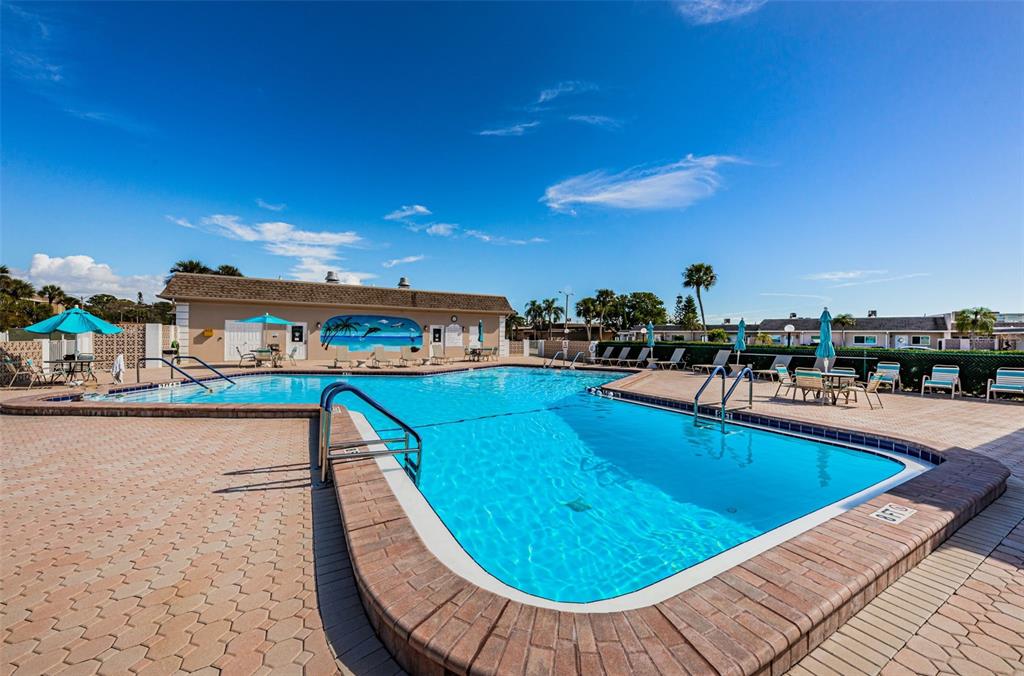 1 Boca Ciega Point Boulevard, Unit 314 St. Petersburg, FL 33708 - Photo 70 of 89 a view of swimming pool with outdoor seating and city view