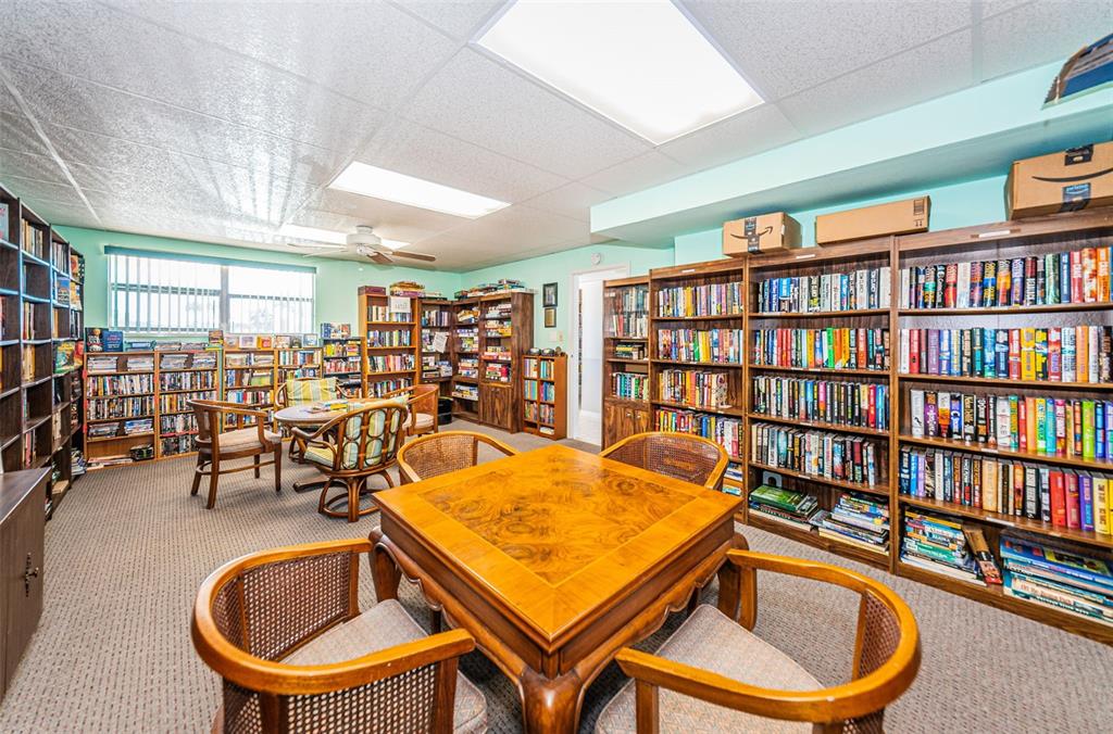 1 Boca Ciega Point Boulevard, Unit 314 St. Petersburg, FL 33708 - Photo 87 of 89 a room with furniture and a book shelf