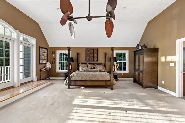 a bedroom with bed and window