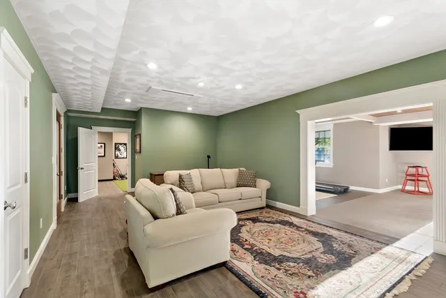 a living room with furniture and a rug