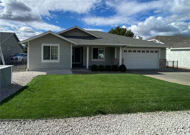 a view of a house with a yard