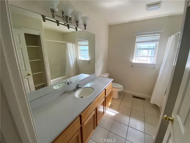 a view of an empty room and a window