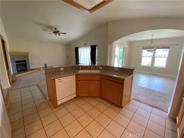 a kitchen with stainless steel appliances a refrigerator sink and cabinets