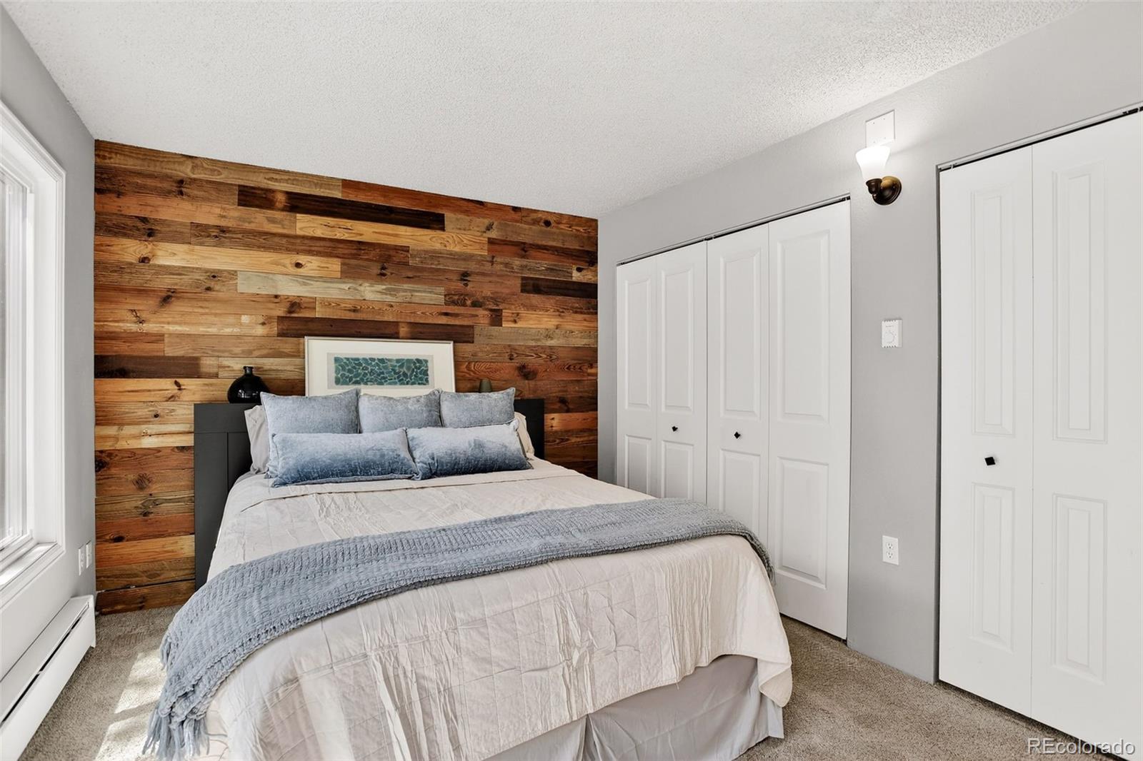 8515 Doubleheader Ranch Road Morrison, CO 80465 - Photo 20 of 42 a bedroom with a bed and a window