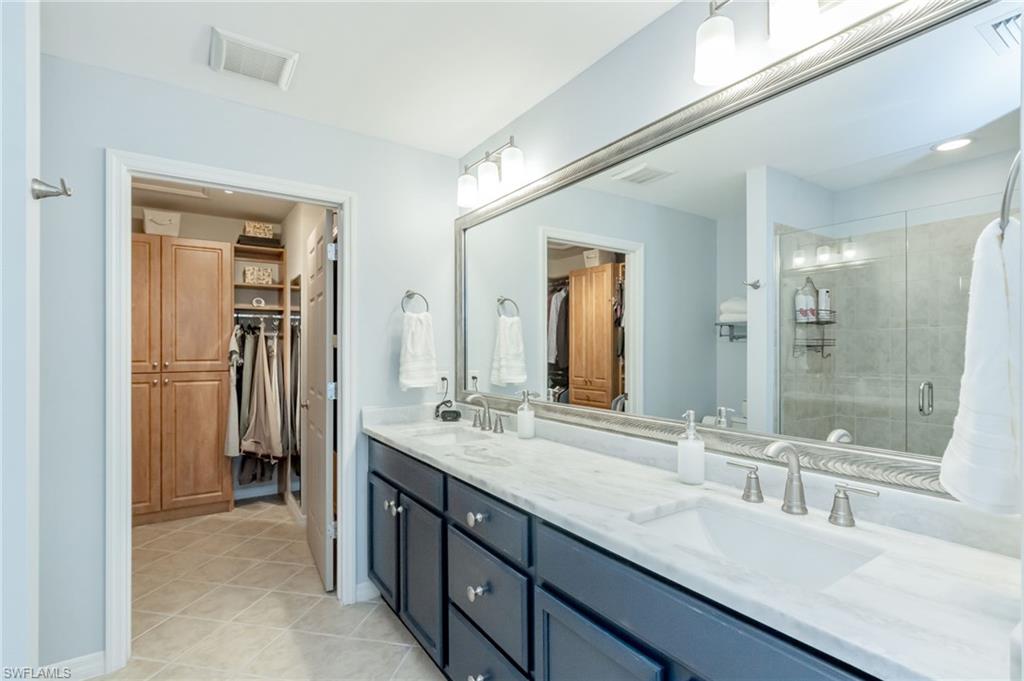 5801 Declaration Court Ave Maria, FL 34142 - Photo 15 of 38 a bathroom with a granite countertop sink mirror and double