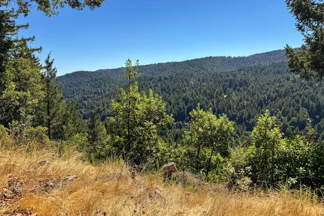 a view of mountain view with mountains in the background