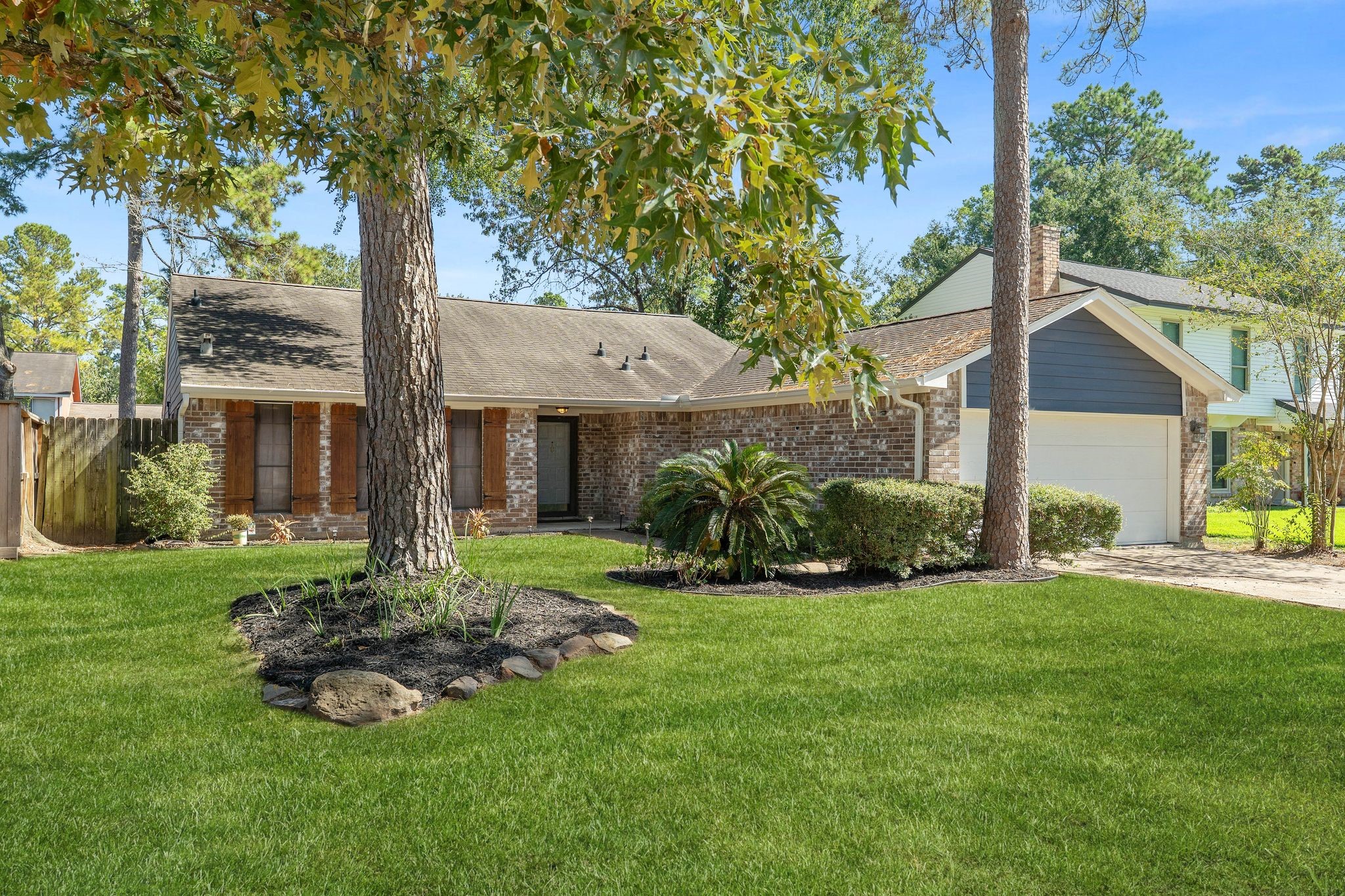 a front view of a house with a yard and porch