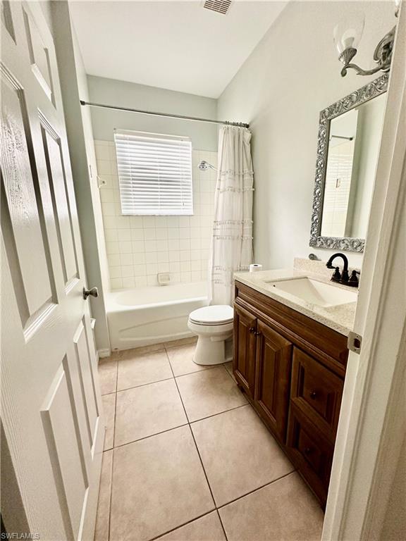 14530 Indigo Lakes Circle Naples, FL 34119 - Photo 15 of 18 a bathroom with a sink a toilet and a mirror