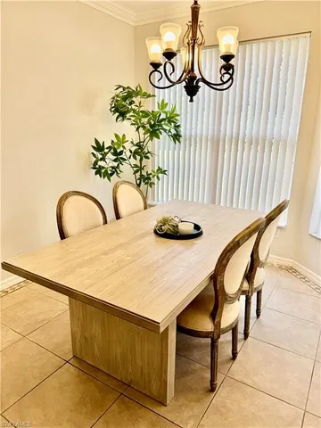 a dining room with table and chairs