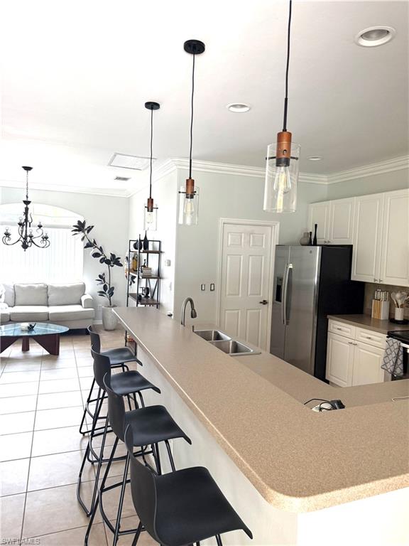 14530 Indigo Lakes Circle Naples, FL 34119 - Photo 7 of 18 a view of a living room and dining room