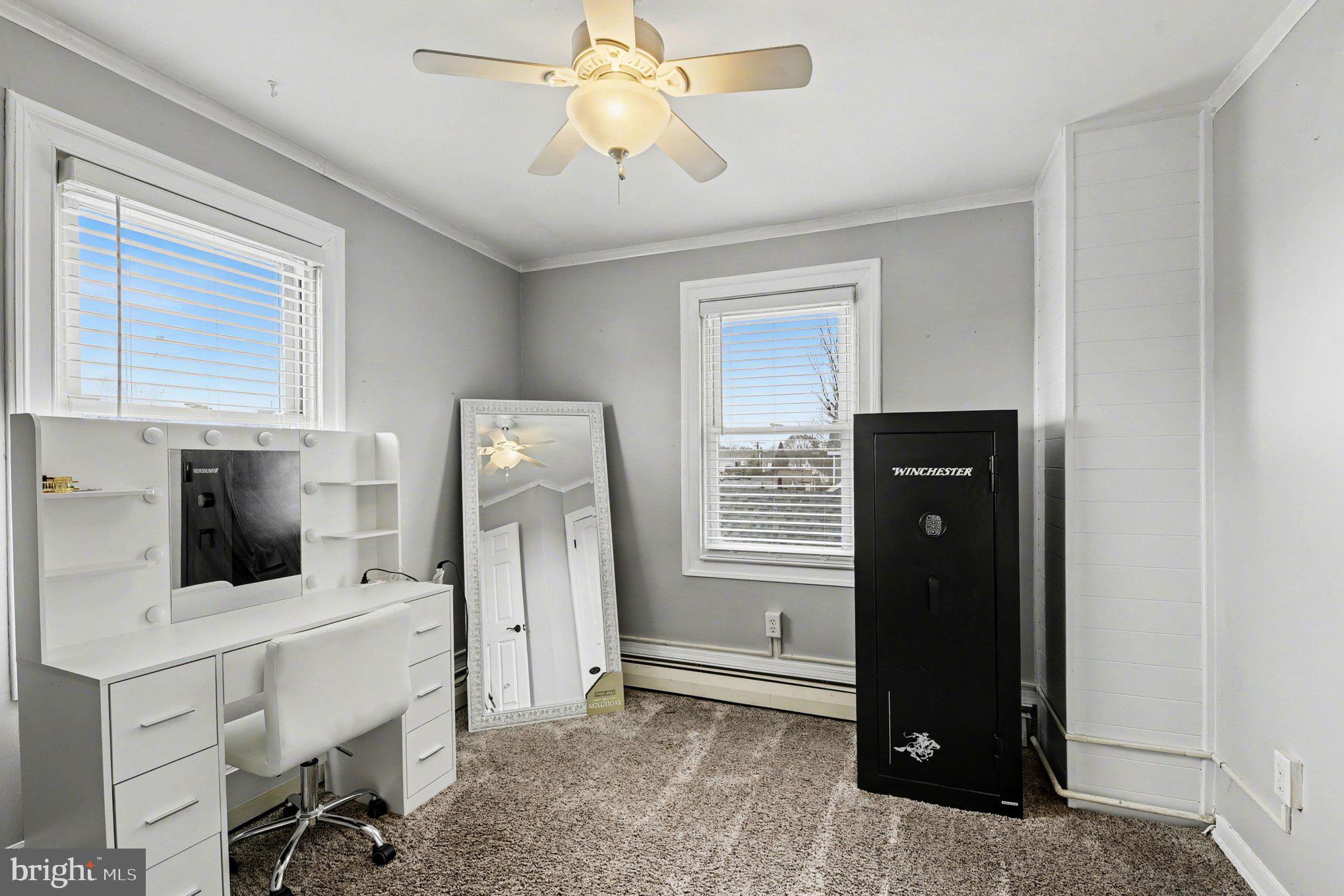 6807 North Point Road Sparrows Point, MD 21219 - Photo 12 of 28 a view of a livingroom with a workspace and a window