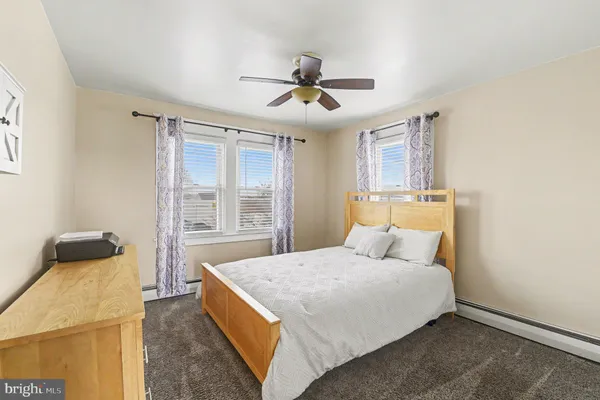 a bed room with a bed and a window