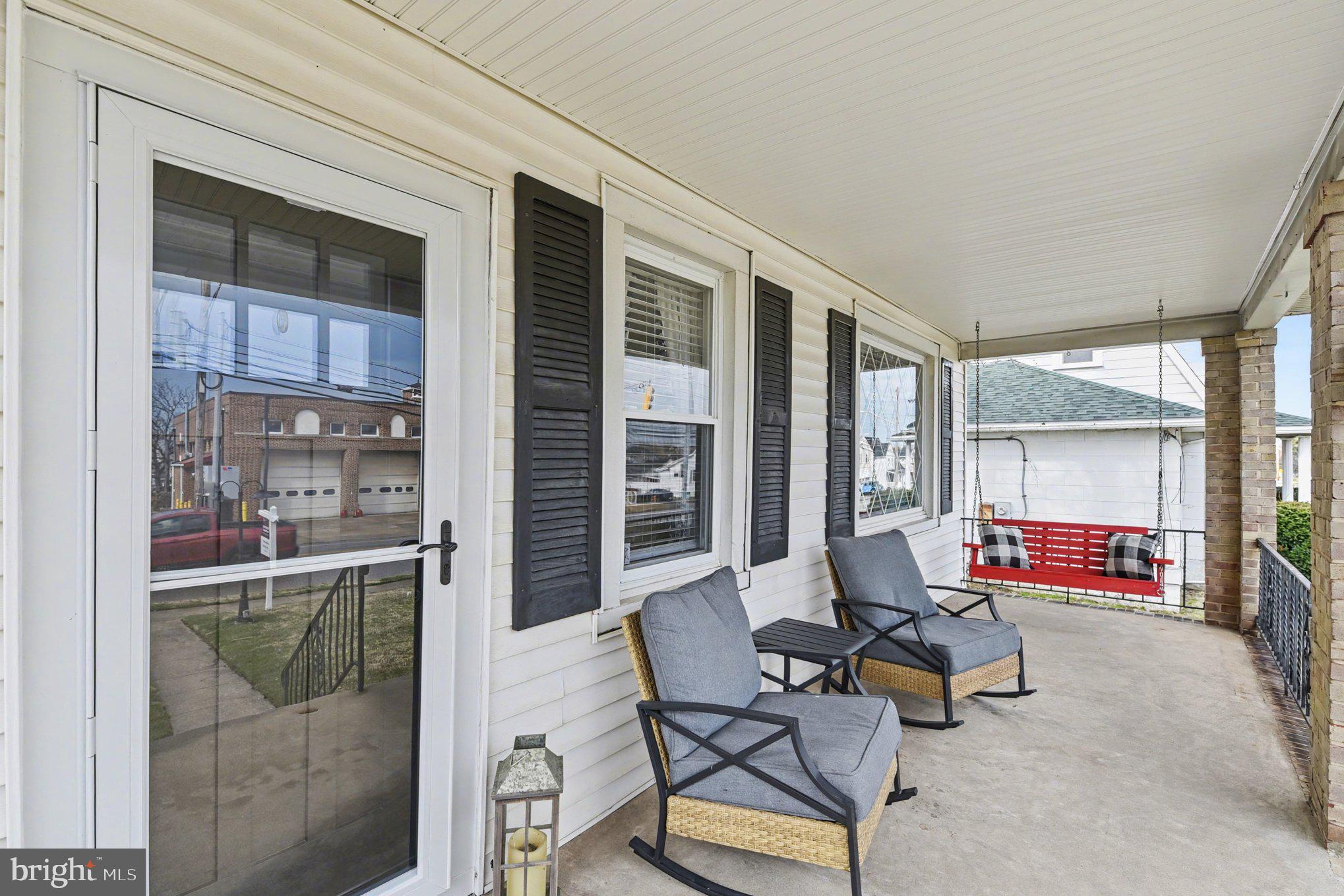 6807 North Point Road Sparrows Point, MD 21219 - Photo 2 of 28 a living room filled with furniture and a potted plant