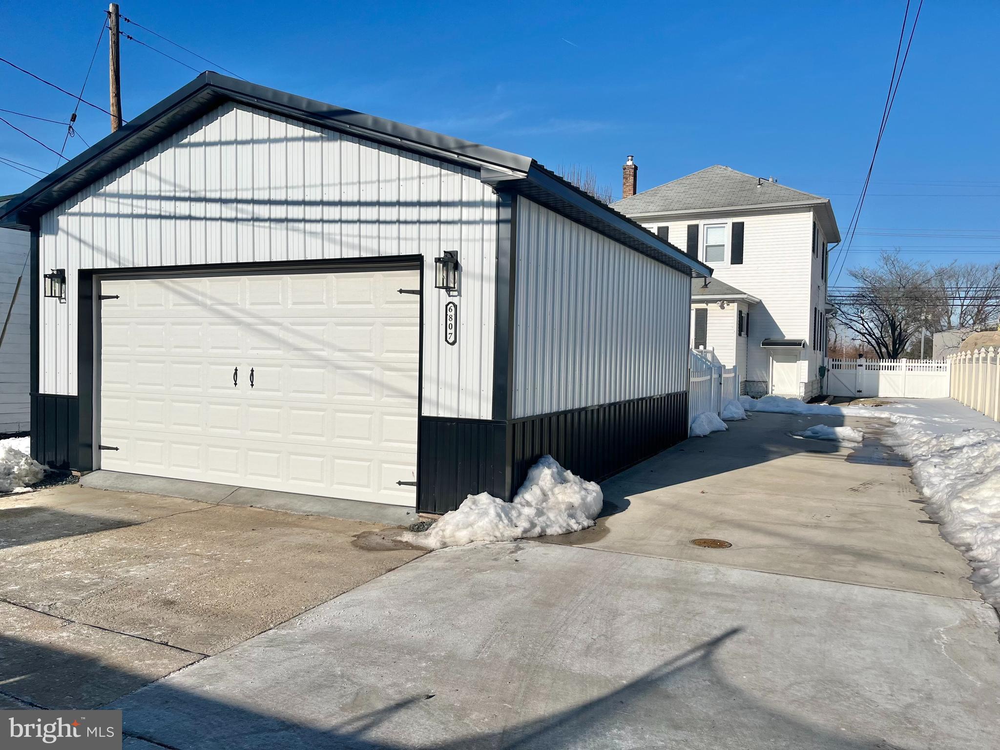 6807 North Point Road Sparrows Point, MD 21219 - Photo 25 of 28 a view of a house with a wooden fence